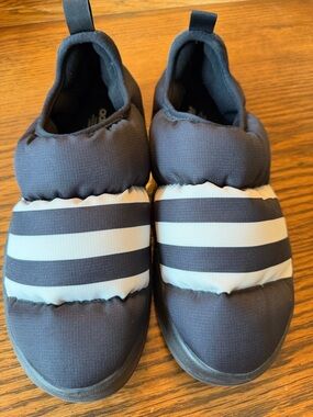 adidas men’s Puffylette Slip-On Athletic Shoes in Black and White